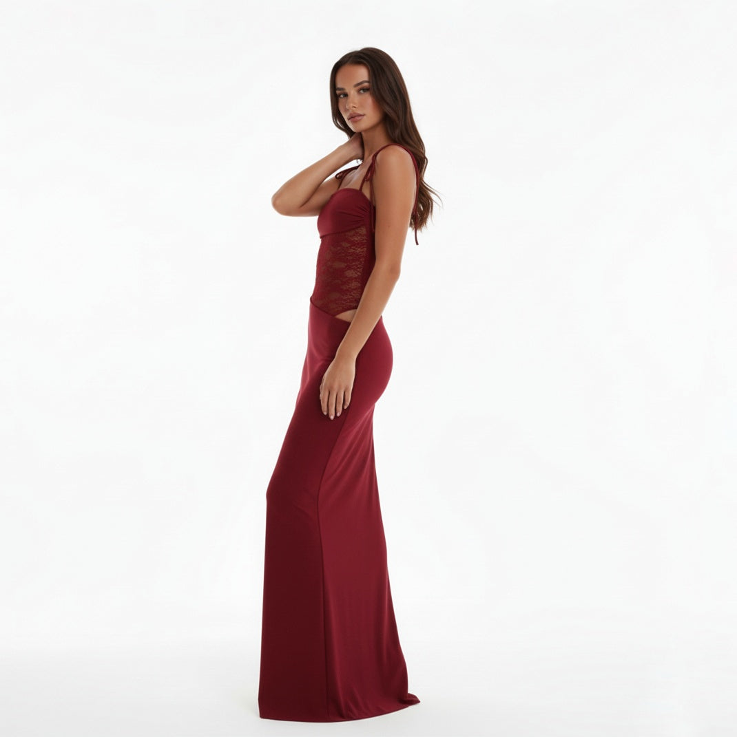 Woman wearing a Claret evening gown with lace detailing on a white background