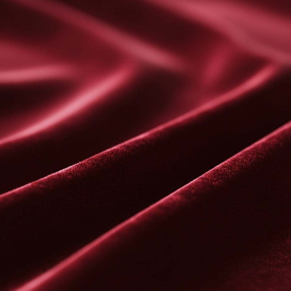 Close-up of Claret velvet fabric with a smooth texture