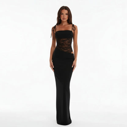 Woman wearing a Black evening gown with lace detailing on a white background